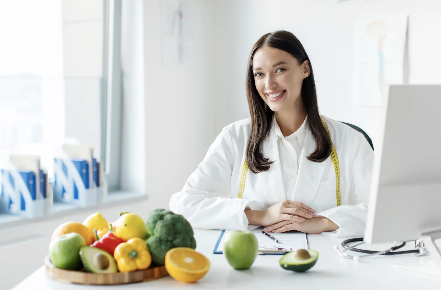 vancouver dietician with tape measure and bowl of vegetables. 
