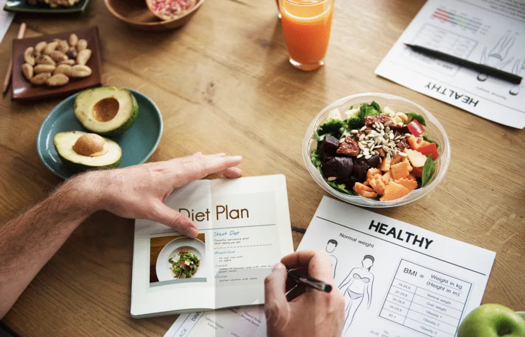 Nutrition Counselling diet plan on a table with healthy food 