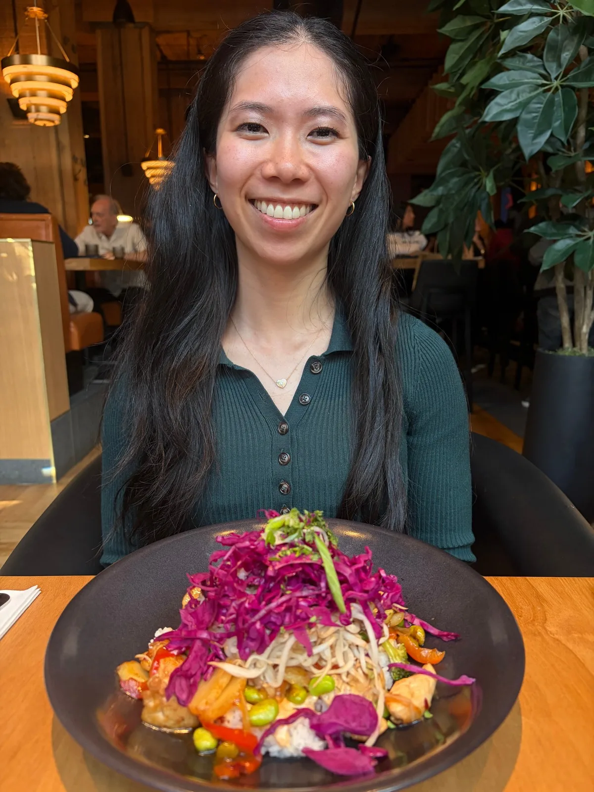 Helen Tieu, Registered Dietitian, with a balanced meal for PCOS nutrition support