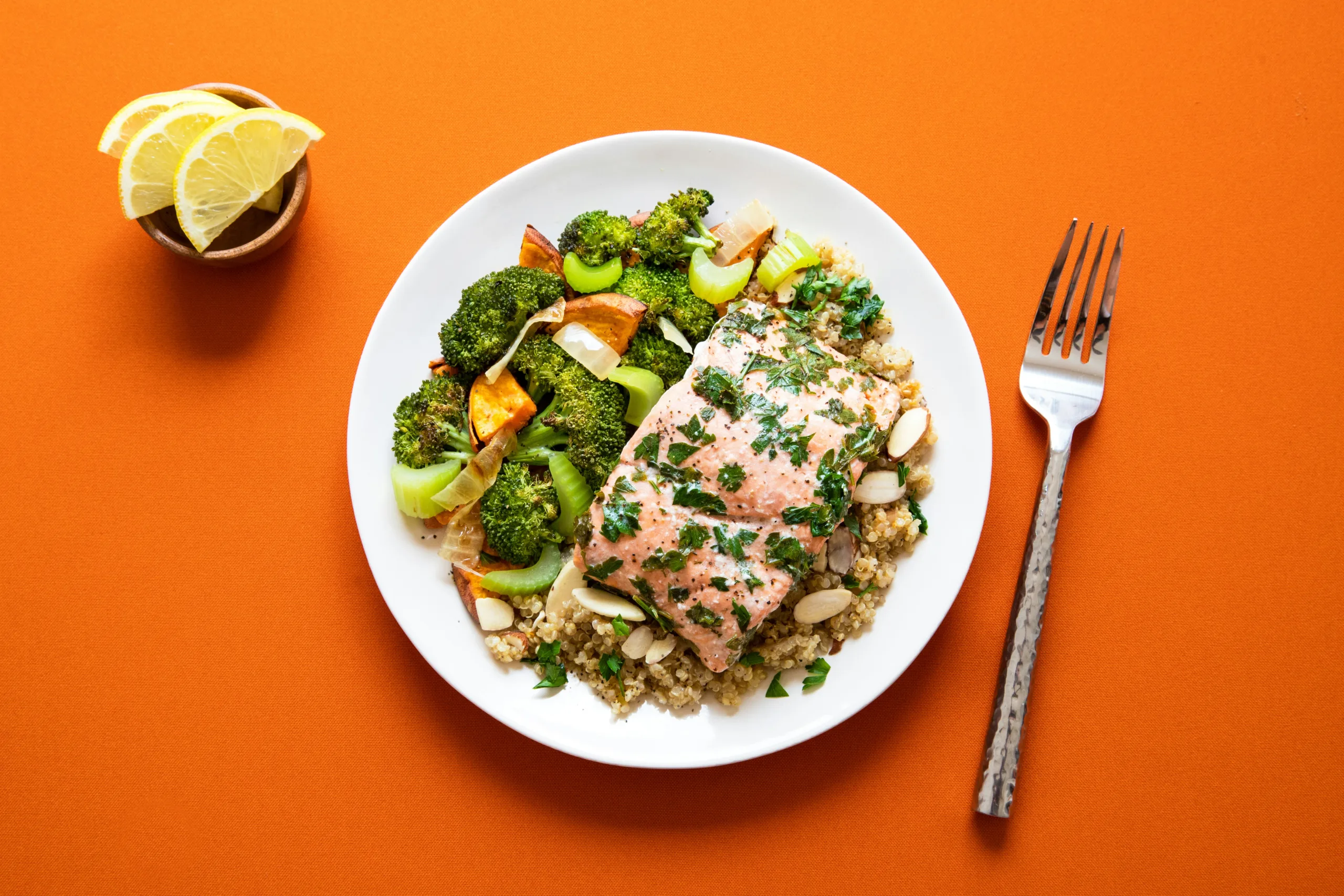 Salmon, quinoa and roasted vegetables on a plate